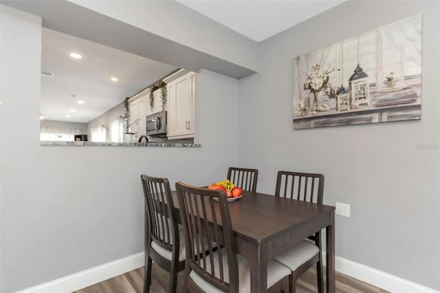 dining area featuring hardwood / wood-style flooring