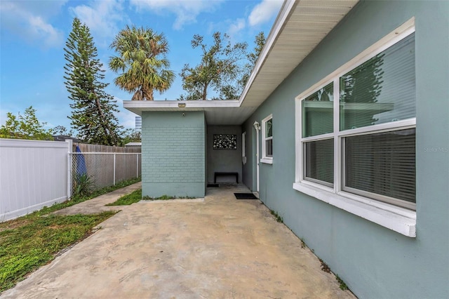 view of side of property featuring a patio