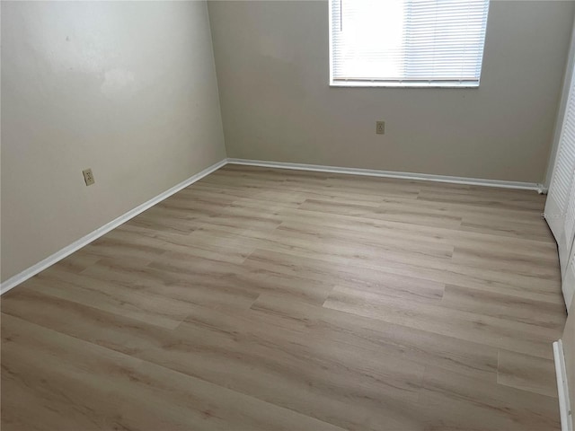 unfurnished room featuring light wood-type flooring