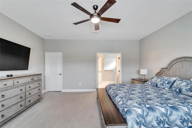 carpeted bedroom featuring ceiling fan and connected bathroom