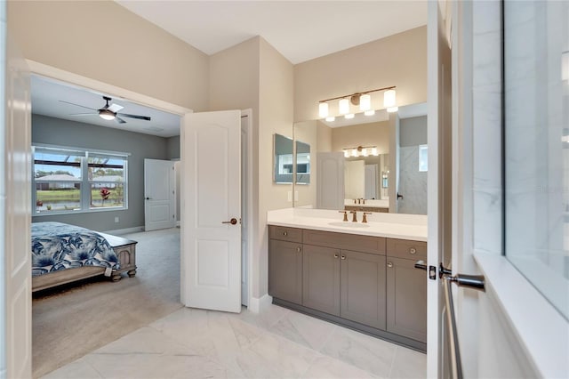 bathroom featuring ceiling fan and vanity