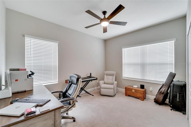 carpeted home office with ceiling fan