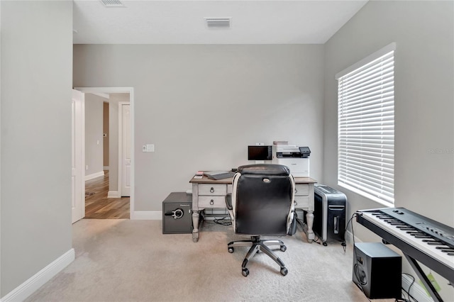 office area with light colored carpet