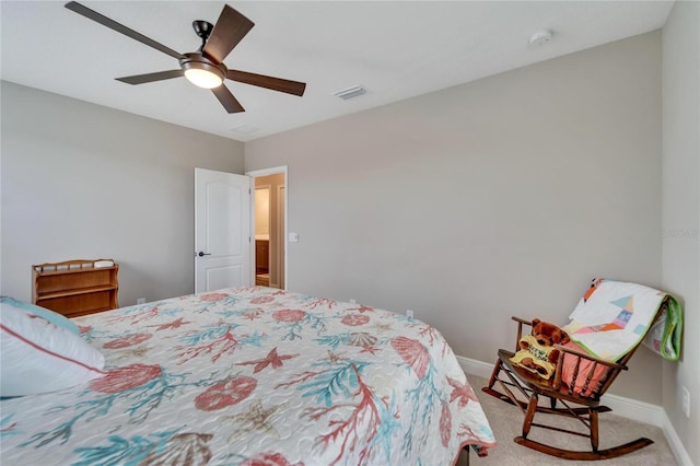 bedroom with ceiling fan and light carpet