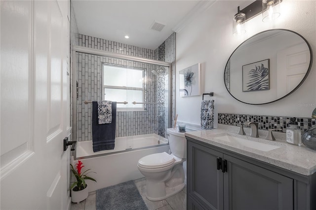 full bathroom featuring toilet, shower / bath combination with glass door, tile patterned floors, and vanity