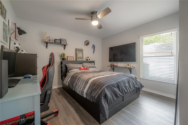 bedroom featuring ceiling fan and wood-type flooring