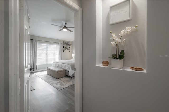 bedroom featuring ceiling fan and light hardwood / wood-style floors