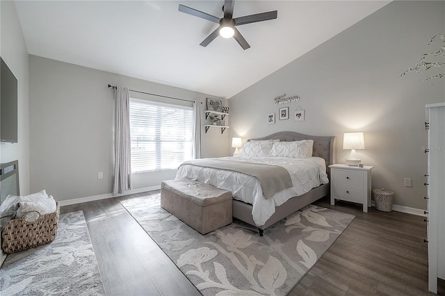 bedroom featuring ceiling fan, hardwood / wood-style floors, and vaulted ceiling