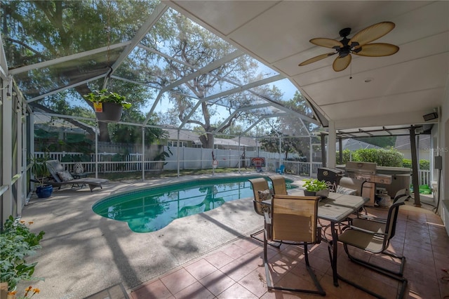 view of pool with ceiling fan, a patio area, grilling area, and a lanai