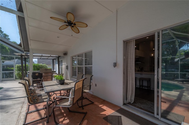 view of patio / terrace with ceiling fan, a lanai, and area for grilling