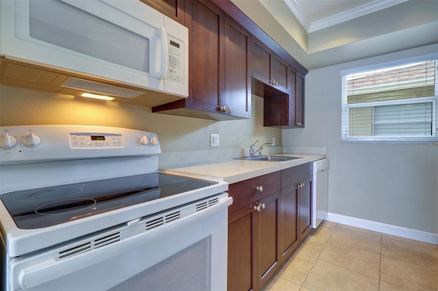 kitchen with crown molding, white appliances, sink, and light tile patterned floors