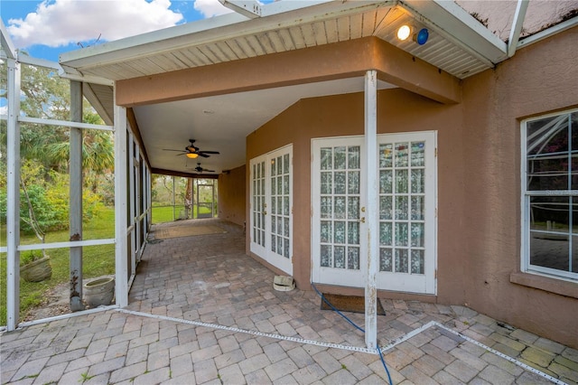 view of patio / terrace featuring ceiling fan and french doors