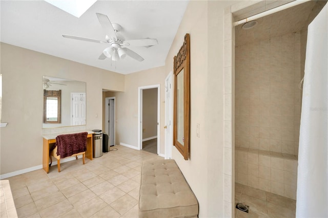 bathroom featuring ceiling fan, tile patterned floors, and tiled shower