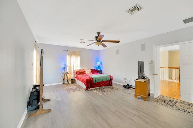 bedroom with hardwood / wood-style floors and ceiling fan