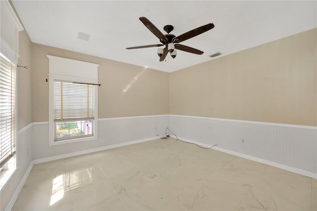 spare room featuring ceiling fan