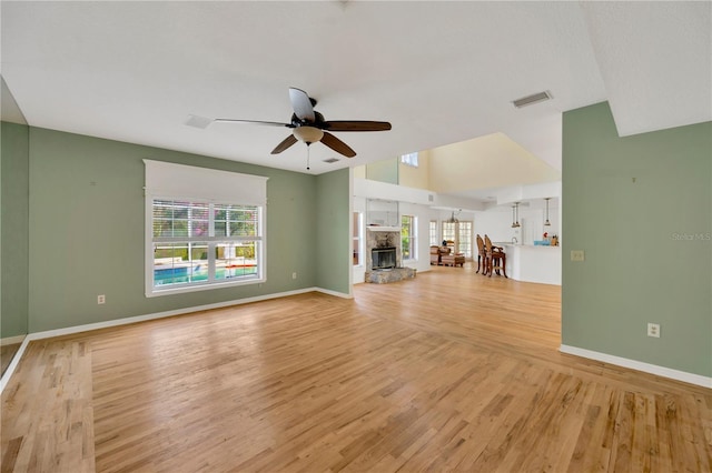 unfurnished living room with light hardwood / wood-style floors and ceiling fan