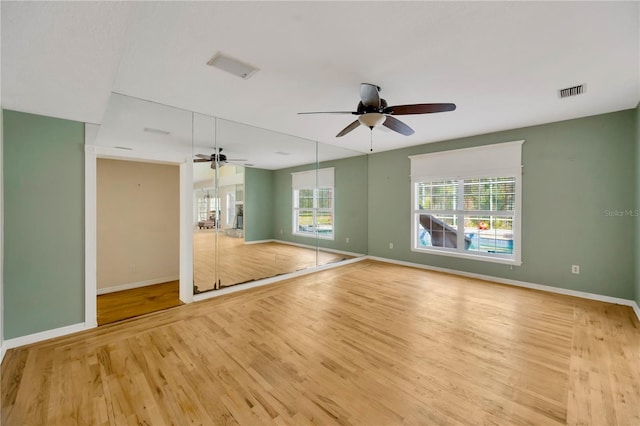 interior space with light hardwood / wood-style flooring and ceiling fan