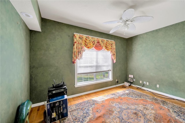 spare room with wood-type flooring and ceiling fan