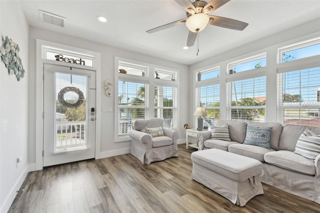 sunroom featuring ceiling fan and a healthy amount of sunlight