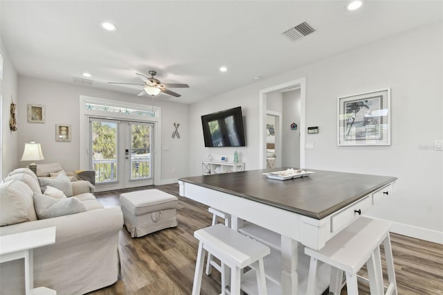 interior space featuring ceiling fan, dark hardwood / wood-style flooring, and french doors