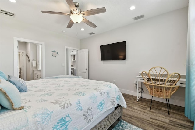 bedroom featuring dark hardwood / wood-style flooring, connected bathroom, and ceiling fan