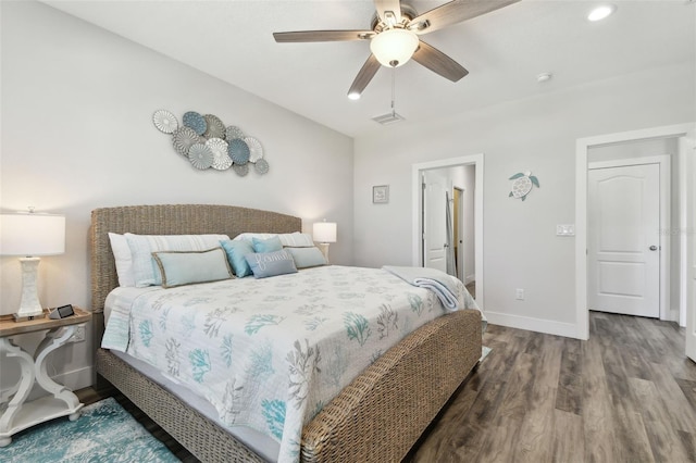 bedroom with ceiling fan and hardwood / wood-style floors