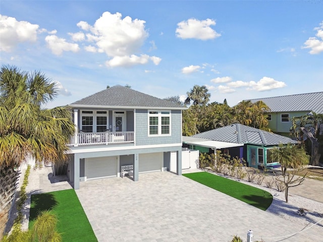 view of front of house with a garage and a balcony