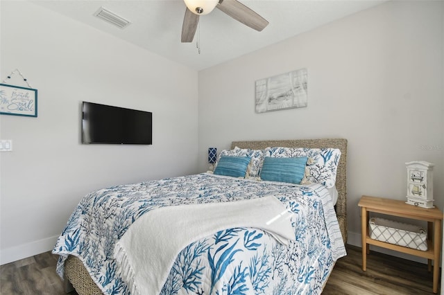 bedroom with dark wood-type flooring and ceiling fan