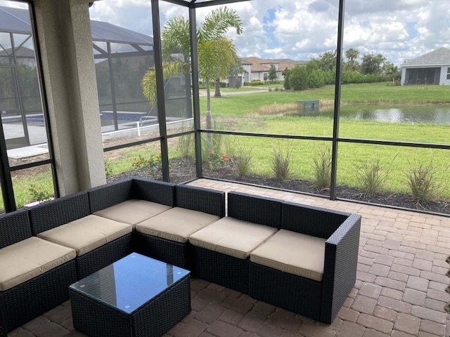 unfurnished sunroom with a water view