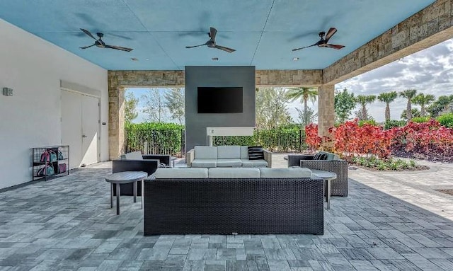 view of patio featuring ceiling fan and an outdoor living space