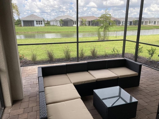 unfurnished sunroom with a water view