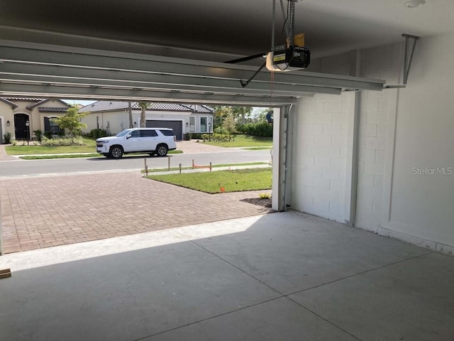 garage featuring a garage door opener