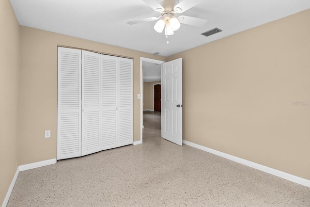 unfurnished bedroom featuring a closet and ceiling fan