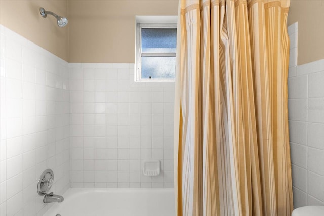 bathroom featuring shower / bath combination with curtain