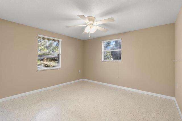 empty room featuring ceiling fan