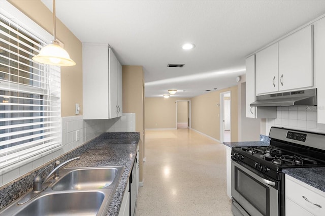 kitchen with sink, backsplash, white cabinetry, and appliances with stainless steel finishes