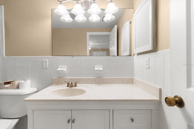 bathroom with toilet and vanity