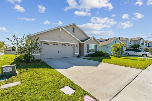 ranch-style home featuring a garage, driveway, a front lawn, and stucco siding