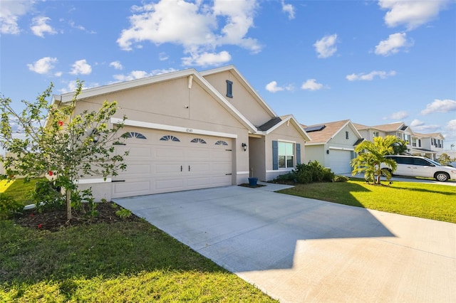 ranch-style house with a garage, concrete driveway, a front lawn, and stucco siding