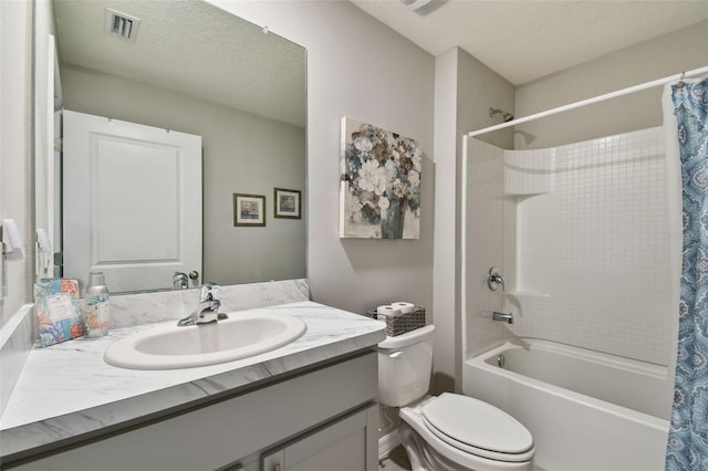 full bath featuring visible vents, shower / bathtub combination with curtain, toilet, a textured ceiling, and vanity