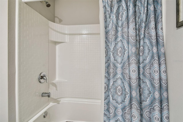 bathroom with shower / bath combo