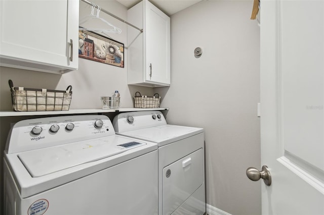 laundry area with cabinet space and independent washer and dryer