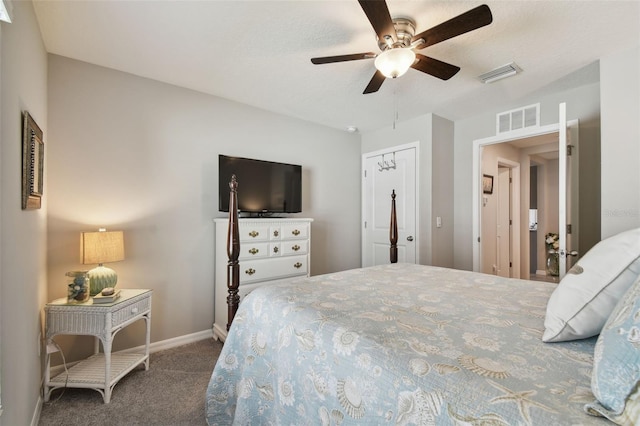 bedroom featuring ceiling fan, carpet floors, visible vents, and baseboards