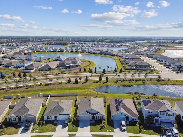 aerial view with a water view and a residential view