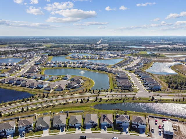 bird's eye view with a residential view and a water view