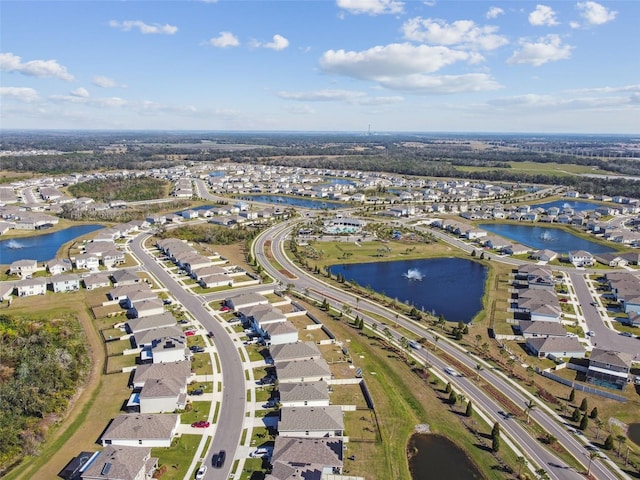 bird's eye view with a water view and a residential view