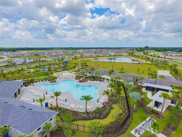 birds eye view of property featuring a water view and a residential view