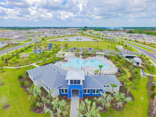 bird's eye view with a residential view and a water view