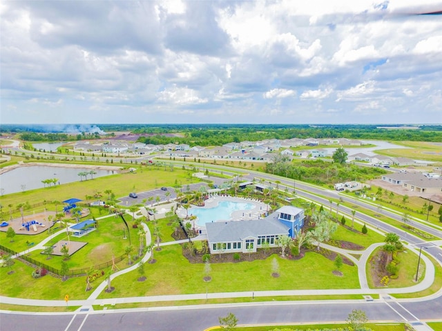 drone / aerial view with a residential view and a water view