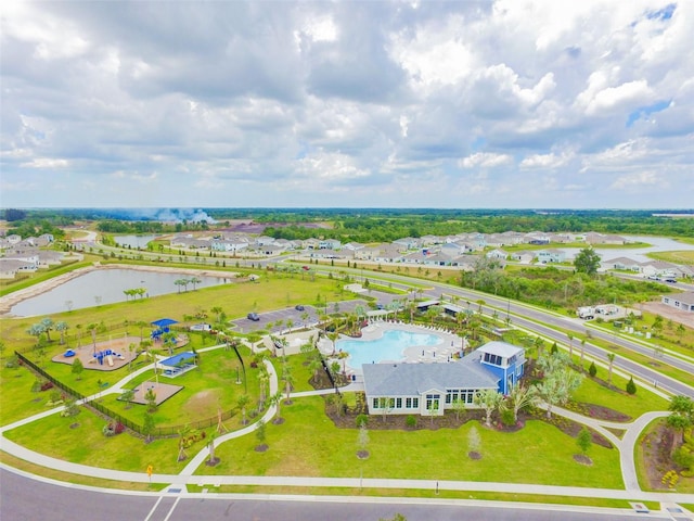 birds eye view of property with a water view